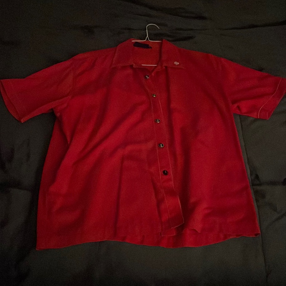 Large button up shirt from Steady with dollar bill signs on the buttons.